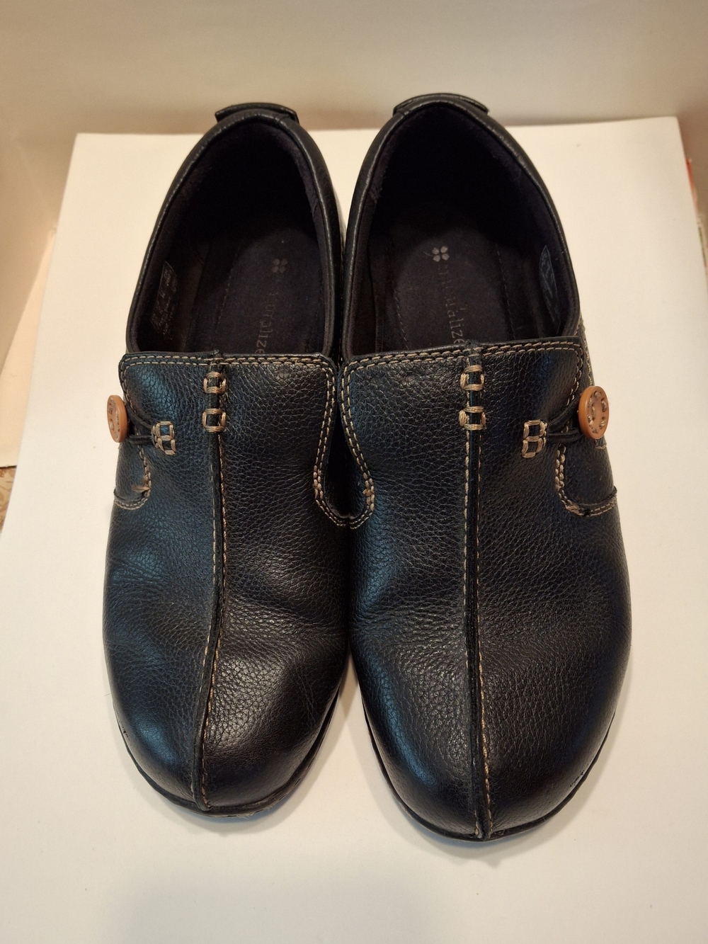 Clarks Black Leather Slip-On Loafers with Brown Button Accent